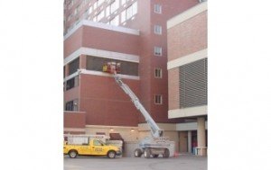 Cherry Picker Cleaning out Fort Worth building